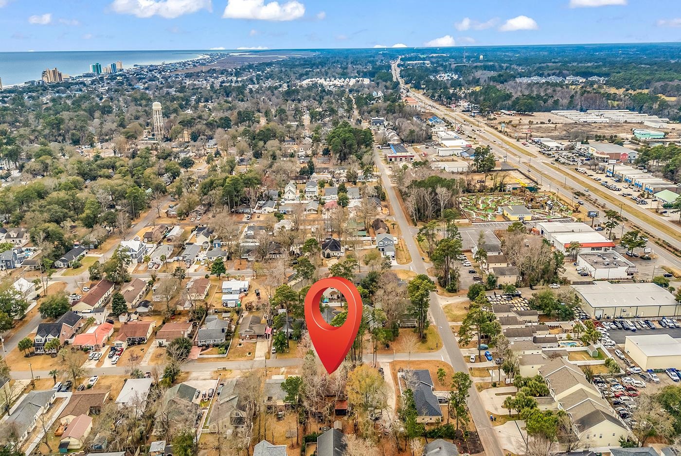 724 Juniper Drive, Unit B Surfside Beach, SC 29575 - Photo 36 of 36 Aerial view of property and surrounding area with nearby suburban area and nearby urban area
