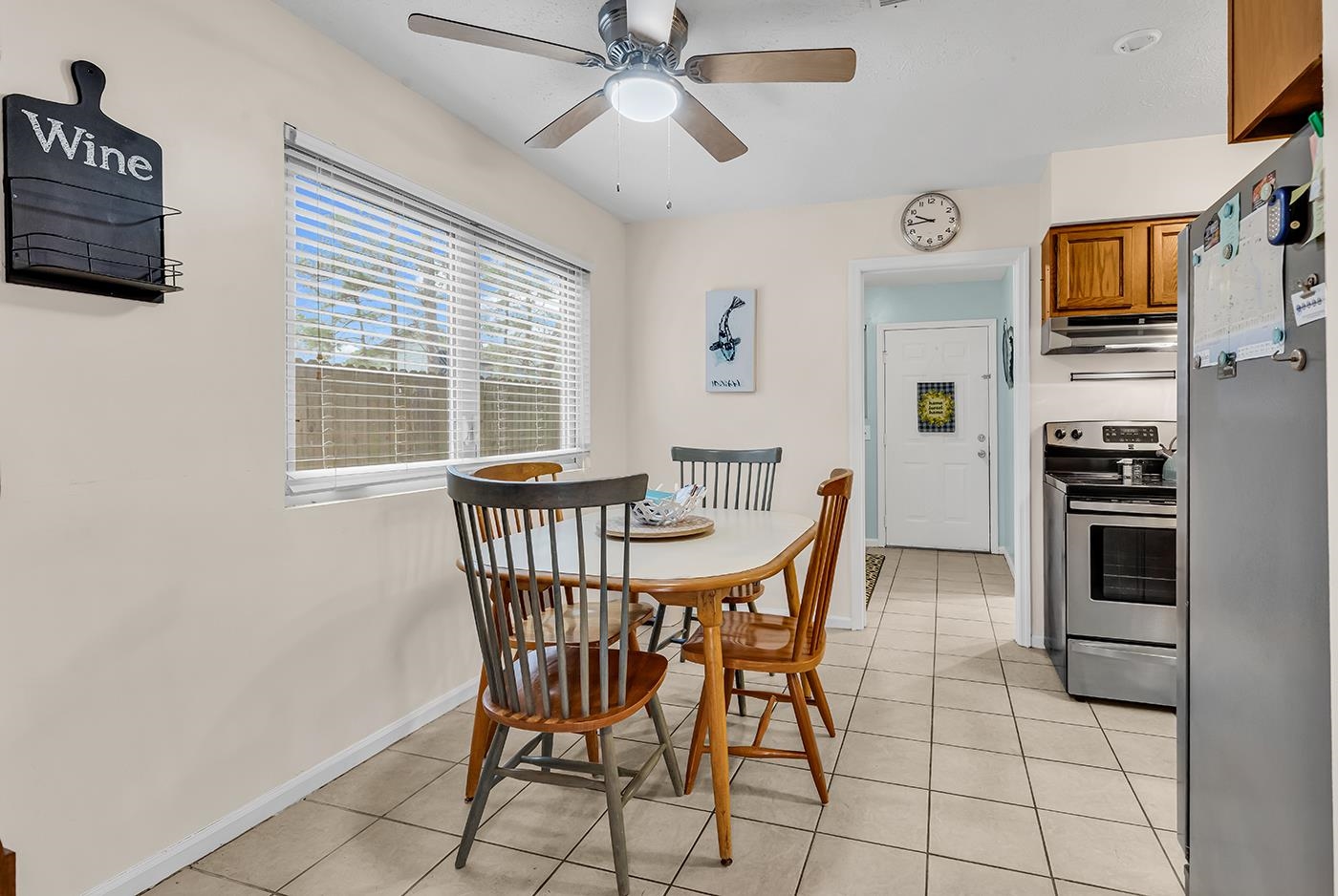 724 Juniper Drive, Unit B Surfside Beach, SC 29575 - Photo 7 of 36 Dining space featuring light tile patterned floors and a ceiling fan