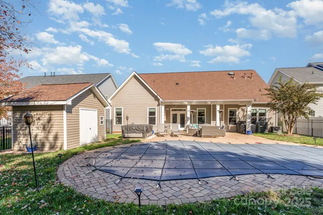 a view of a backyard with a patio