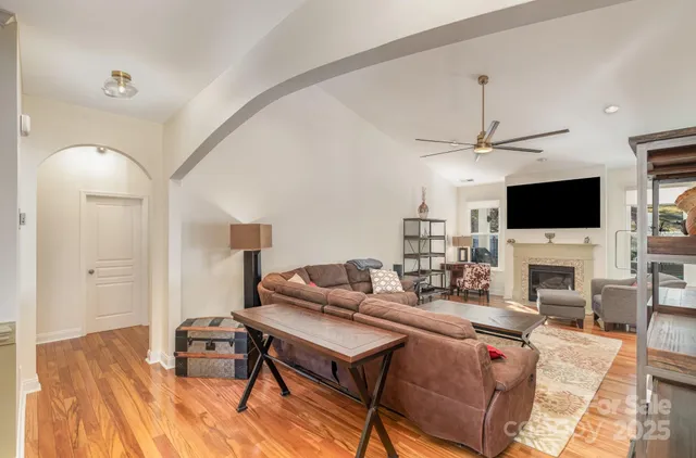 a view of a livingroom with furniture and a flat screen tv