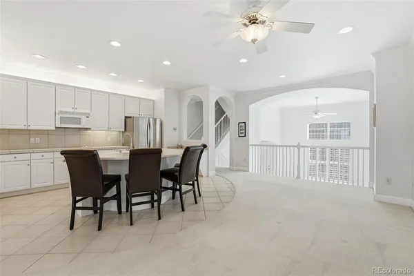 a view of a livingroom with furniture and a kitchen