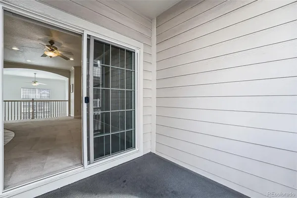 a view of a house with wooden deck