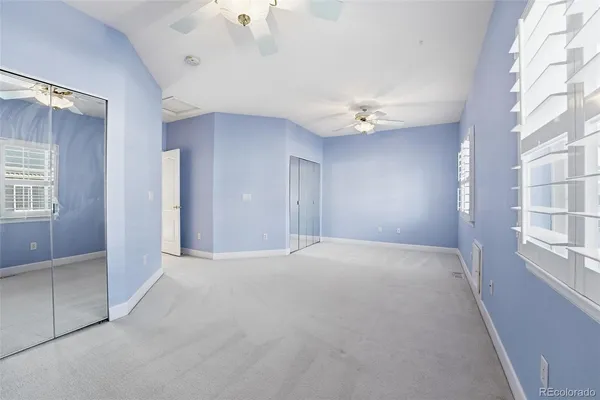 a bathroom with a shower sink vanity mirror and toilet