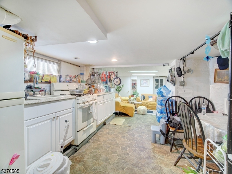 73 South Maple Avenue Springfield, NJ 07081 - Photo 25 of 26 a kitchen with sink and white cabinets