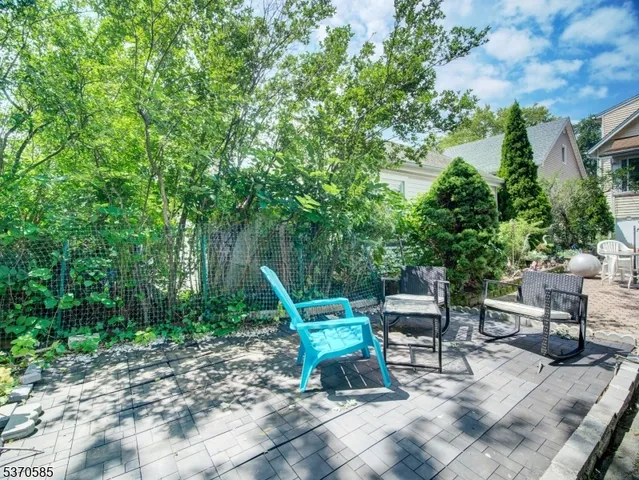 a view of a bench in a backyard