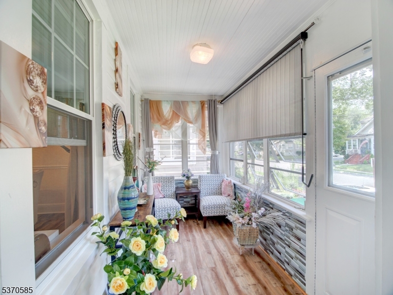 73 South Maple Avenue Springfield, NJ 07081 - Photo 8 of 26 a living room with furniture and a large window