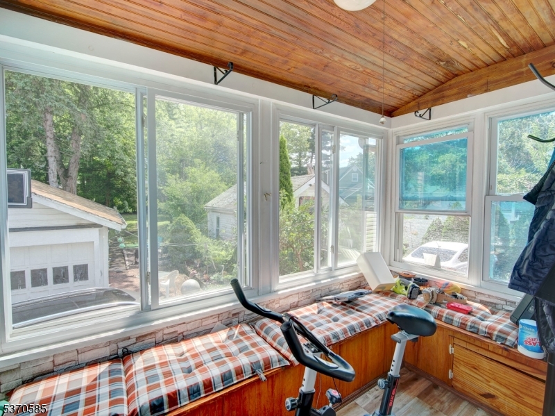 73 South Maple Avenue Springfield, NJ 07081 - Photo 9 of 26 a bedroom with furniture and large windows