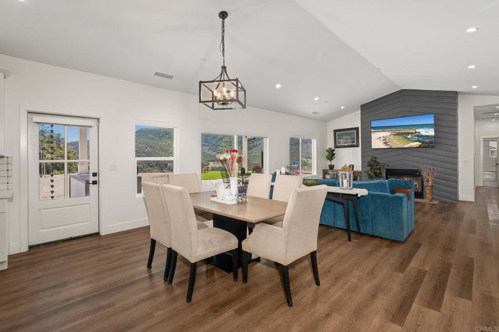 15663 Mathew Road Valley Center, CA 92082 - Photo 11 of 55 a view of a dining room with furniture window and wooden floor