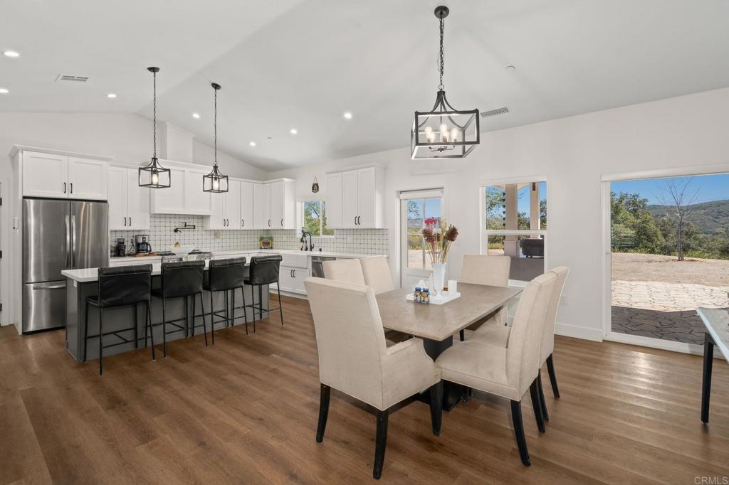 15663 Mathew Road Valley Center, CA 92082 - Photo 12 of 55 a view of a dining room with furniture window and wooden floor