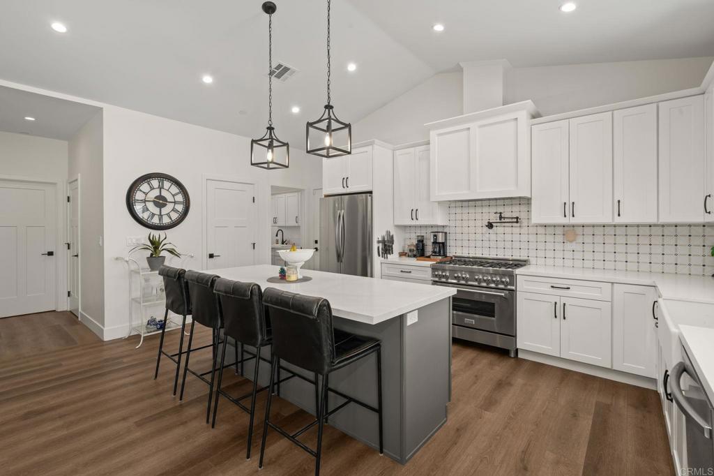 15663 Mathew Road Valley Center, CA 92082 - Photo 15 of 55 a kitchen with a table and chairs in it