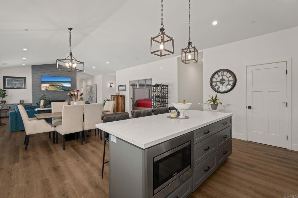 15663 Mathew Road Valley Center, CA 92082 - Photo 16 of 55 a living room with furniture a clock and a table