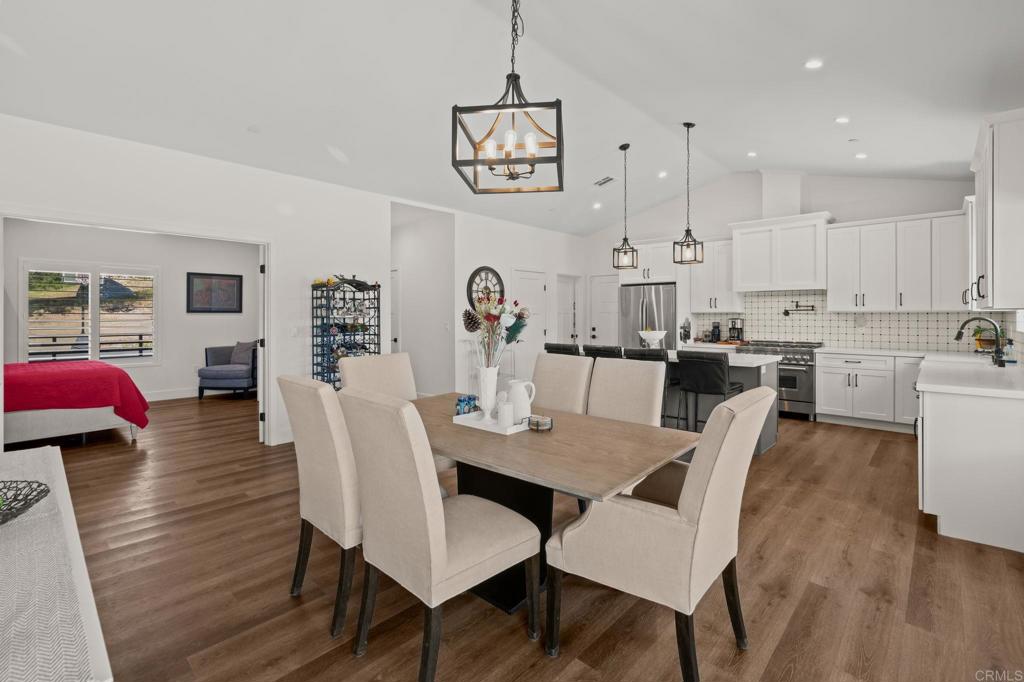 15663 Mathew Road Valley Center, CA 92082 - Photo 9 of 55 a view of a dining room with furniture and wooden floor