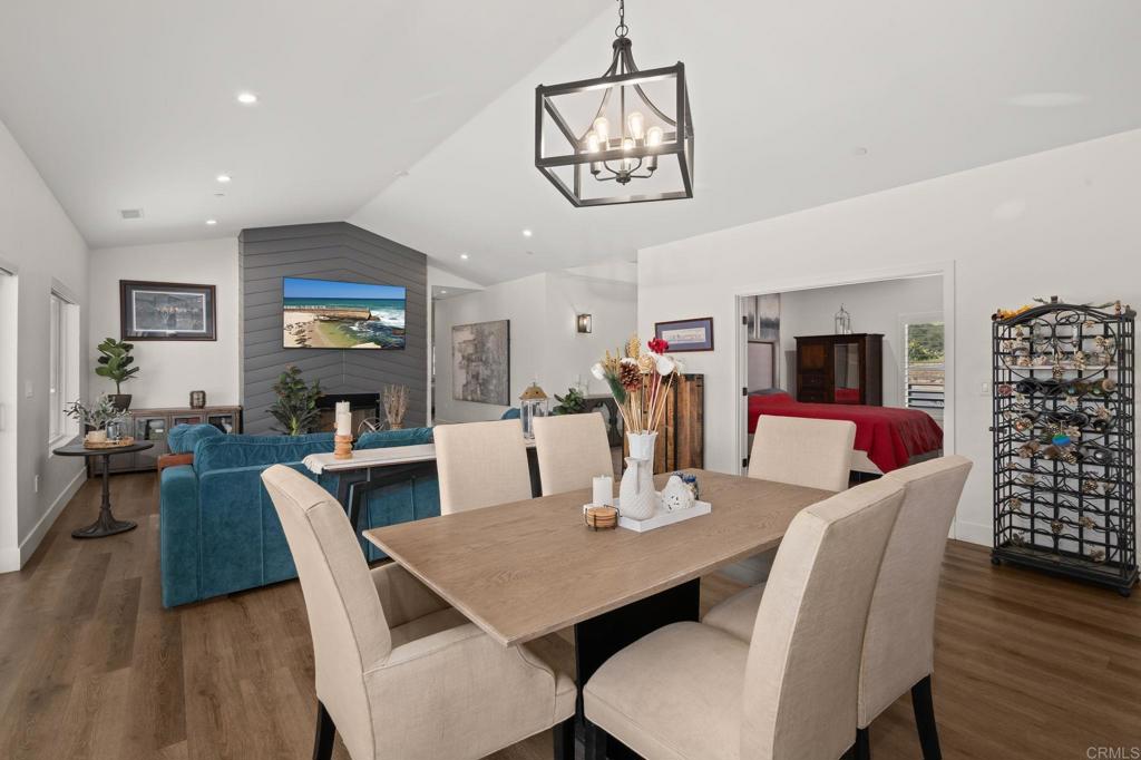 15663 Mathew Road Valley Center, CA 92082 - Photo 10 of 55 a view of a dining room with furniture a chandelier and wooden floor