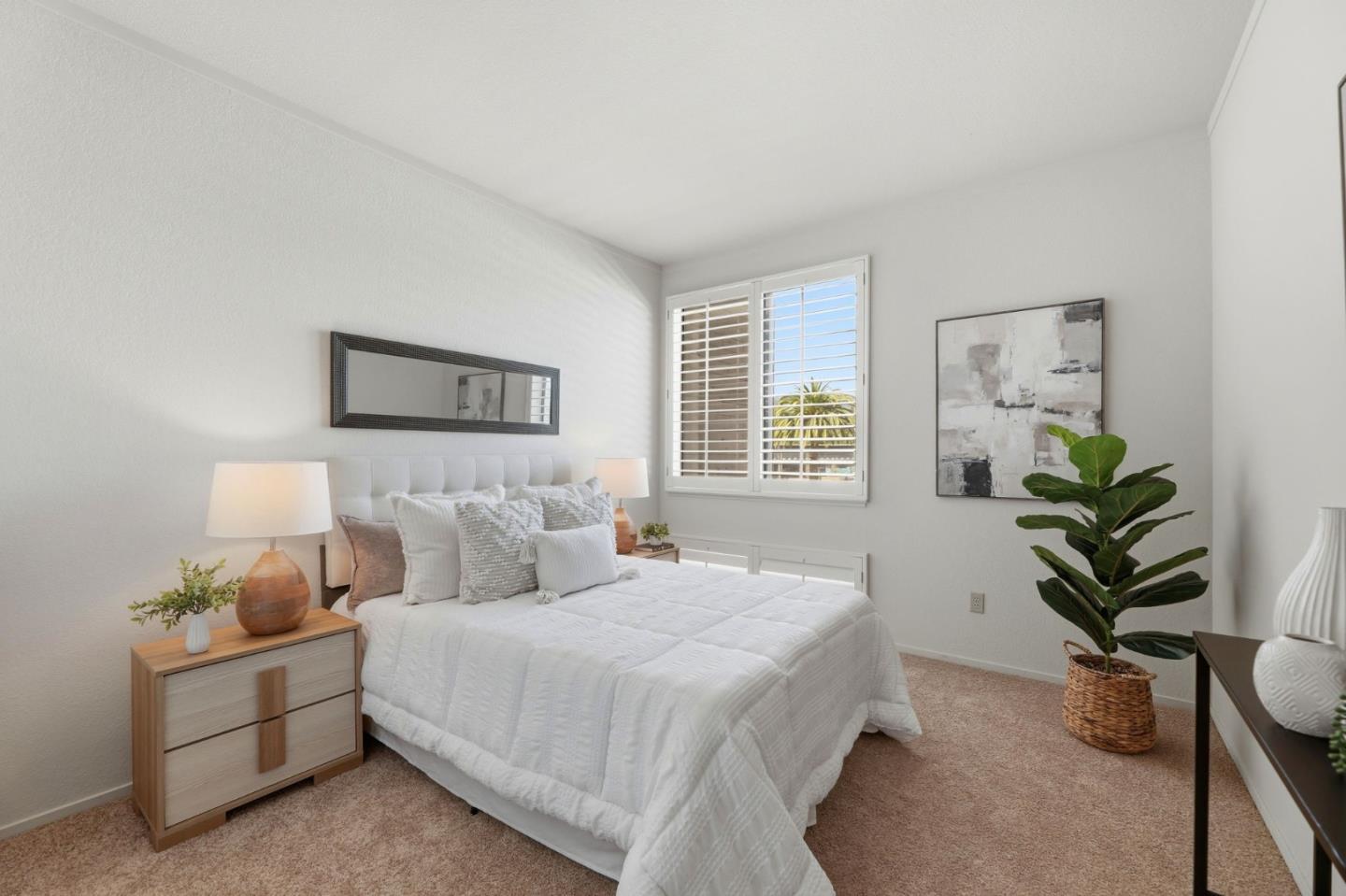 22330 Homestead Road, Unit 226 Cupertino, CA 95014 - Photo 27 of 38 a bedroom with bed and a potted plant