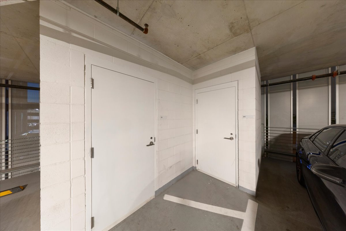 313 West 17th Street, Unit 1104 Austin, TX 78701 - Photo 20 of 40 Two private Level 2 penthouse storage rooms on Level 2 (#71 & #72), positioned directly beside the assigned parking spaces for exceptional convenience and easy access. Outfitted with custom Elfa® shelving for organized, efficient storage. Immediately adjacent to both parking spaces.