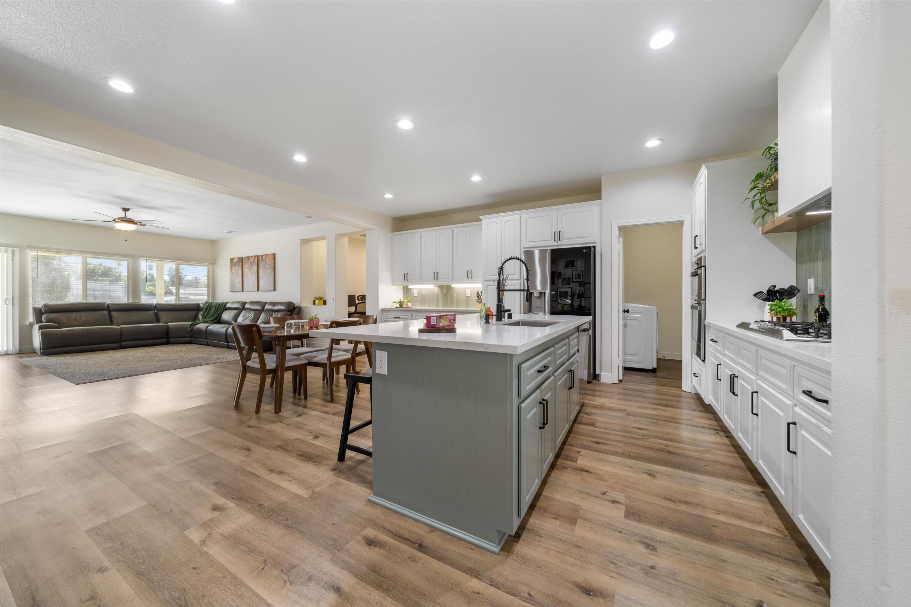 19475 Spalding Avenue Riverside, CA 92508 - Photo 11 of 50 a large white dining hall with stainless steel appliances granite countertop a large counter top and a stove