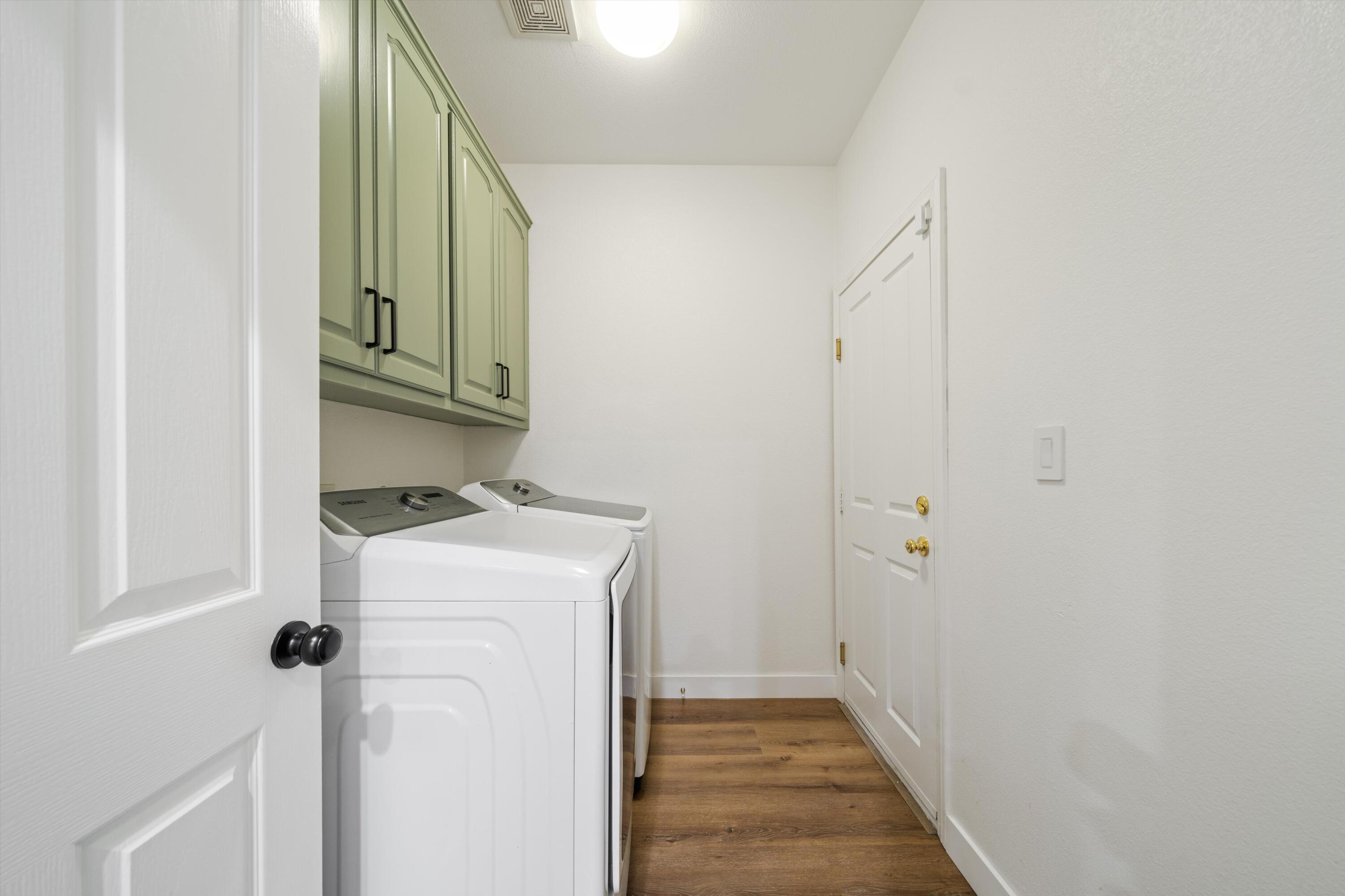 19475 Spalding Avenue Riverside, CA 92508 - Photo 12 of 50 a view of a hallway with washer and dryer