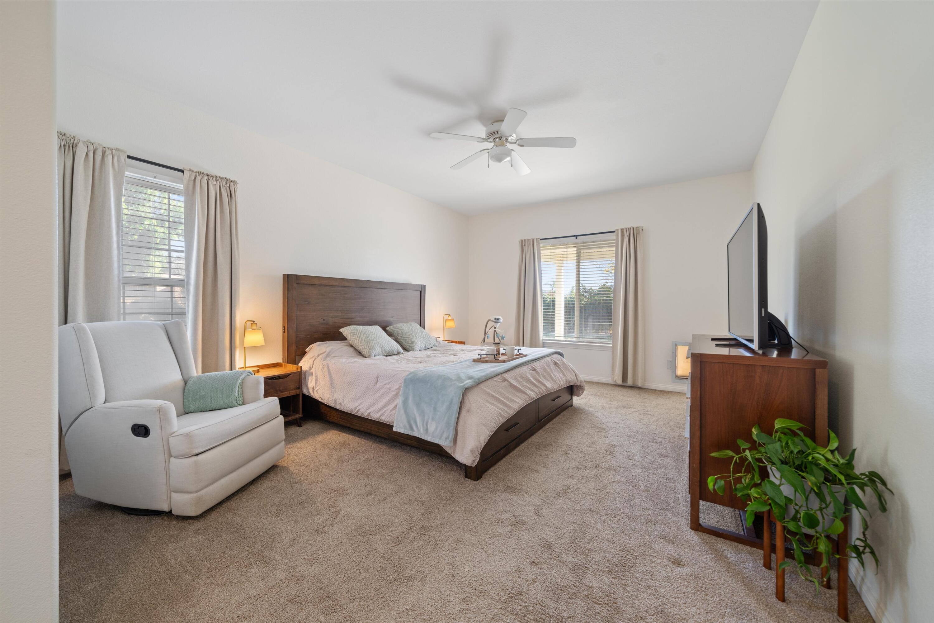 19475 Spalding Avenue Riverside, CA 92508 - Photo 18 of 50 a bedroom with a bed table chair and a couch