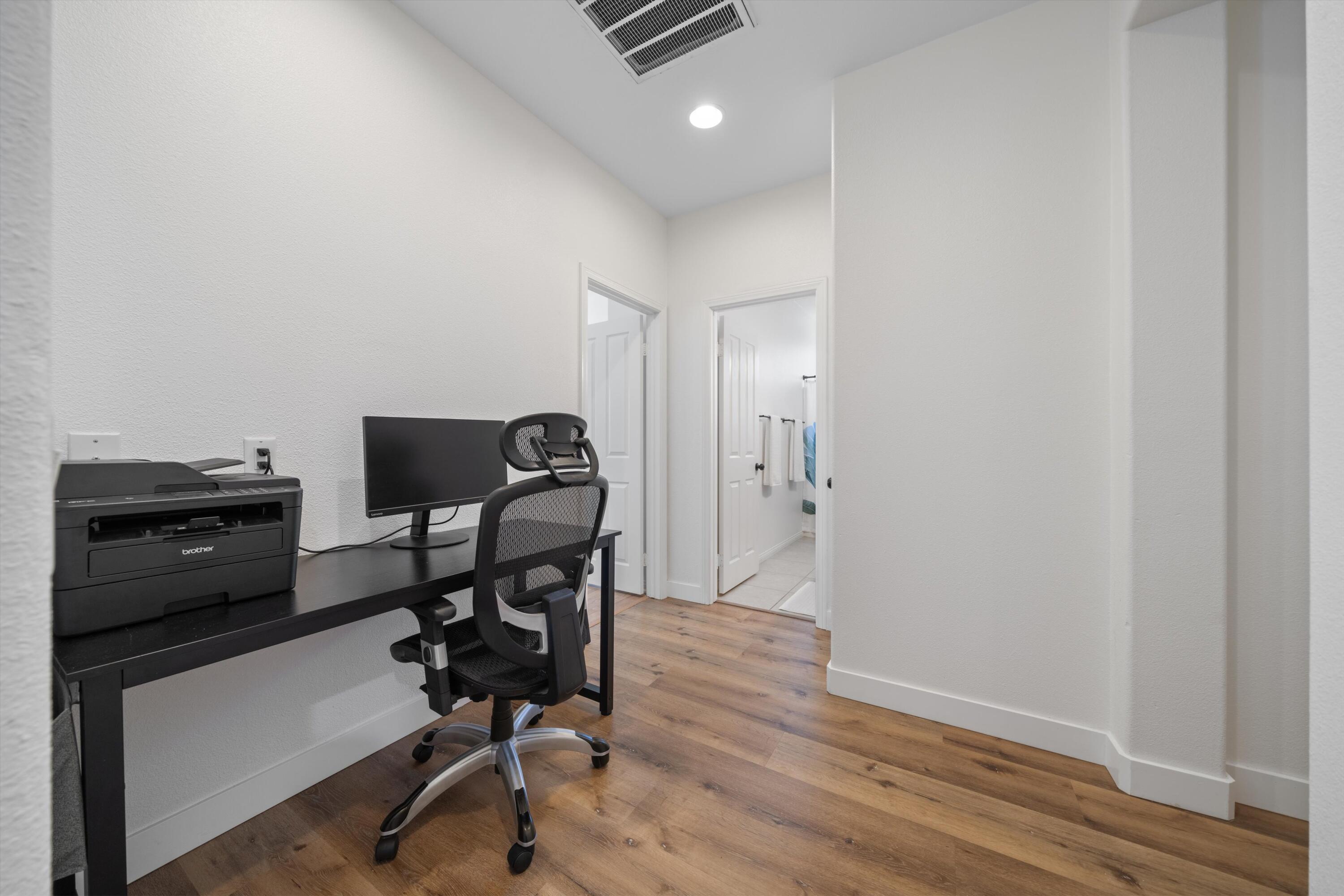 19475 Spalding Avenue Riverside, CA 92508 - Photo 21 of 50 a view of a workspace with furniture and wooden floor