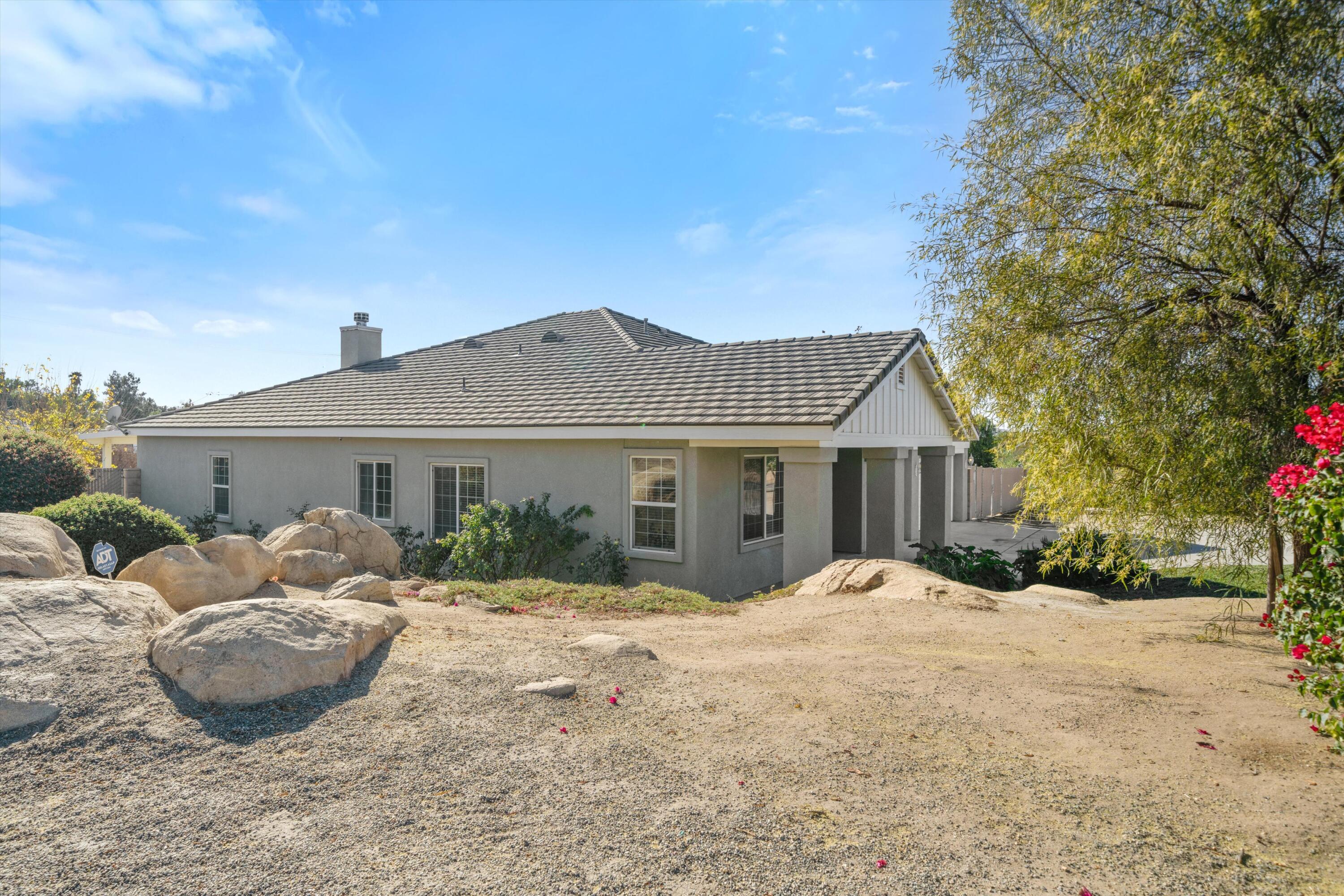 19475 Spalding Avenue Riverside, CA 92508 - Photo 43 of 50 a view of a house with a yard