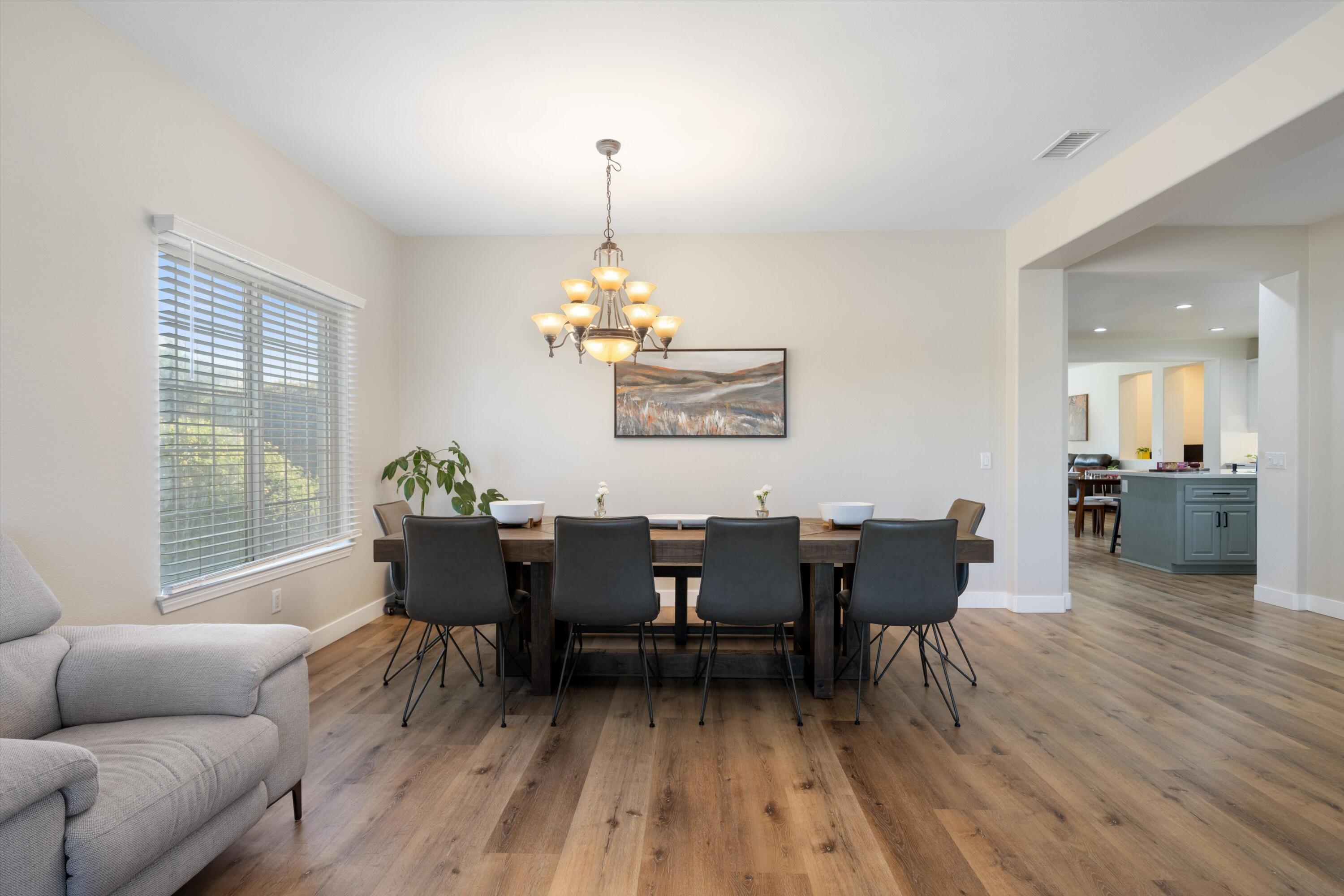 19475 Spalding Avenue Riverside, CA 92508 - Photo 7 of 50 a view of a dining room with furniture and wooden floor
