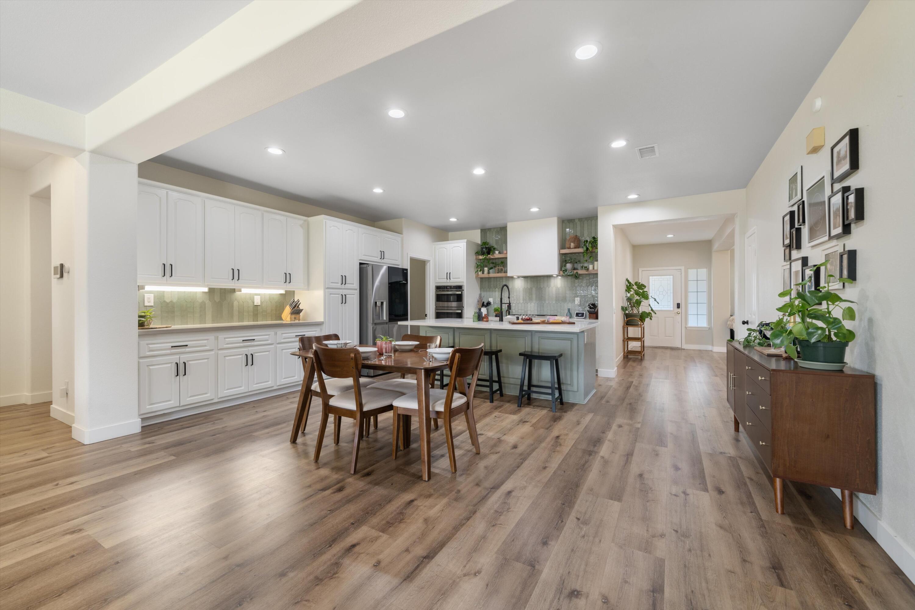 19475 Spalding Avenue Riverside, CA 92508 - Photo 8 of 50 a living room with stainless steel appliances furniture wooden floor and a kitchen view