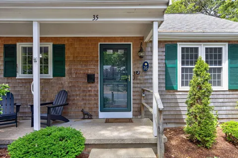 a front view of a house with garden