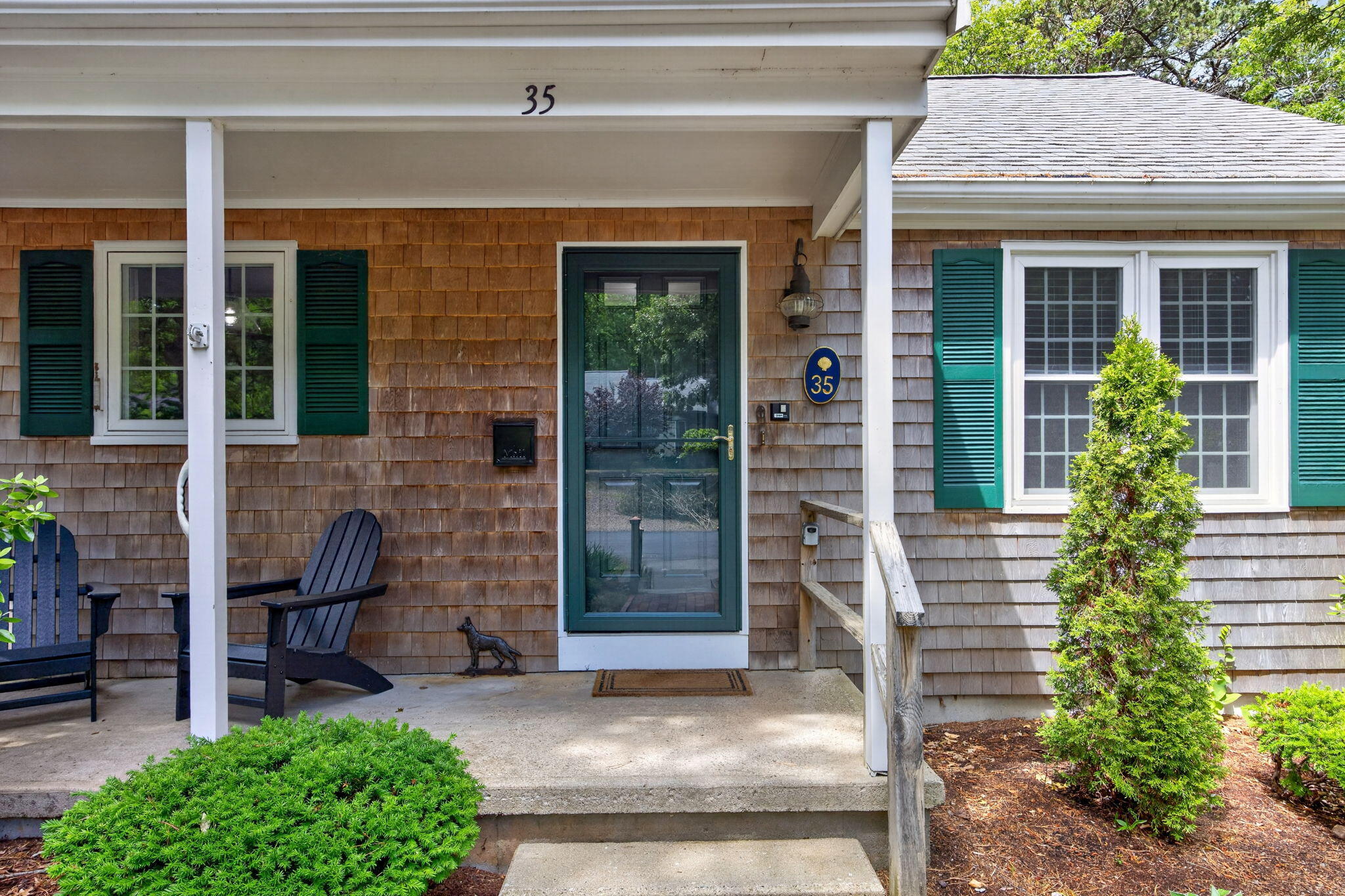 35 Debs Hill Road, Unit 35 Yarmouth Port, MA 02675 - Photo 2 of 36 a front view of a house with garden
