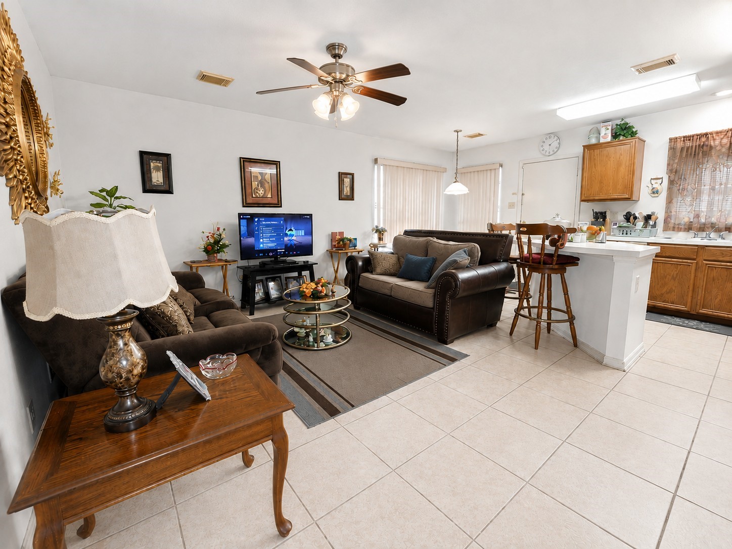 14102 Twisted Rattan Lane Houston, TX 77015 - Photo 9 of 28 Spacious open-concept family room flows seamlessly into the kitchen and breakfast area, offering a functional layout with plenty of space for everyday living and entertaining.