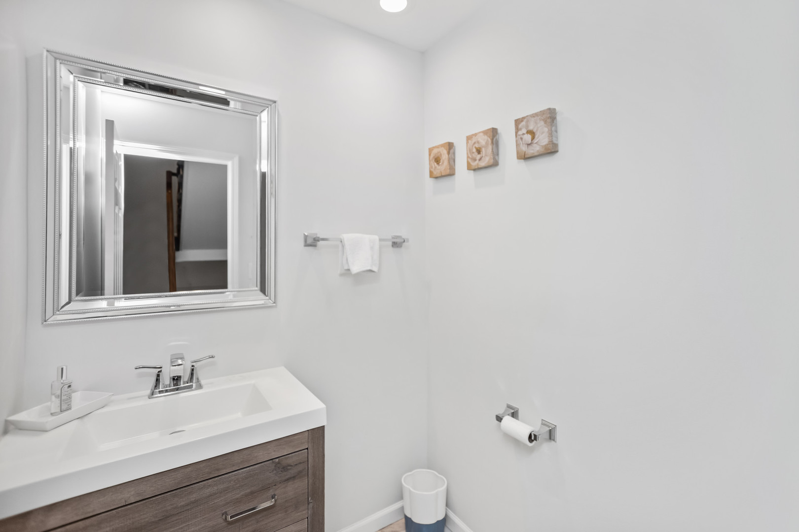 15 Landmark Street Northfield, IL 60093 - Photo 14 of 24 a bathroom with a toilet sink and mirror