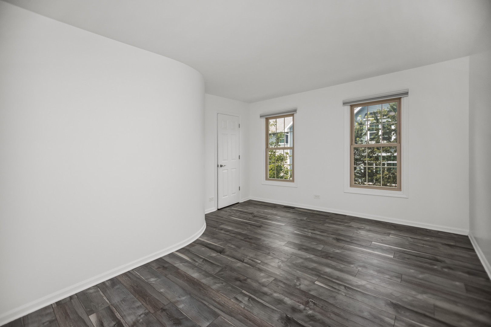 15 Landmark Street Northfield, IL 60093 - Photo 21 of 24 an empty room with wooden floor and windows
