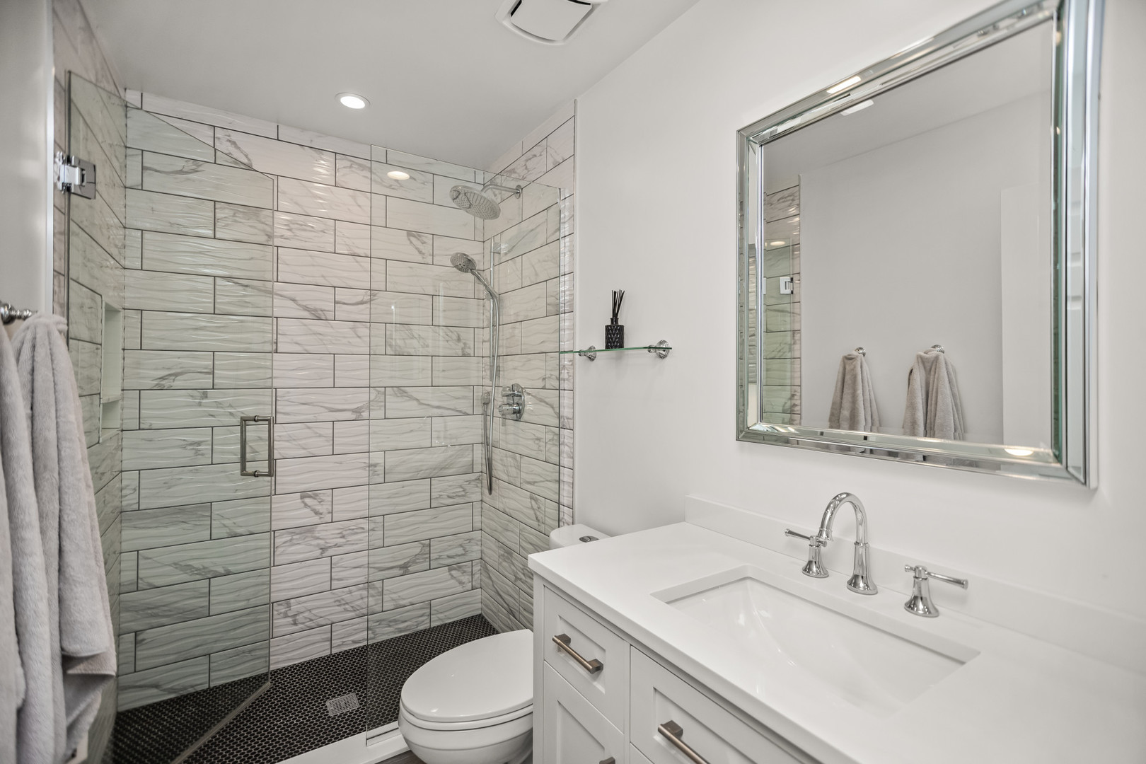 15 Landmark Street Northfield, IL 60093 - Photo 23 of 24 a bathroom with a sink a toilet and shower