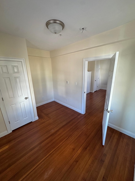 293 Broadway, Unit 2R Methuen, MA 01844 - Photo 5 of 6 a view of empty room with wooden floor
