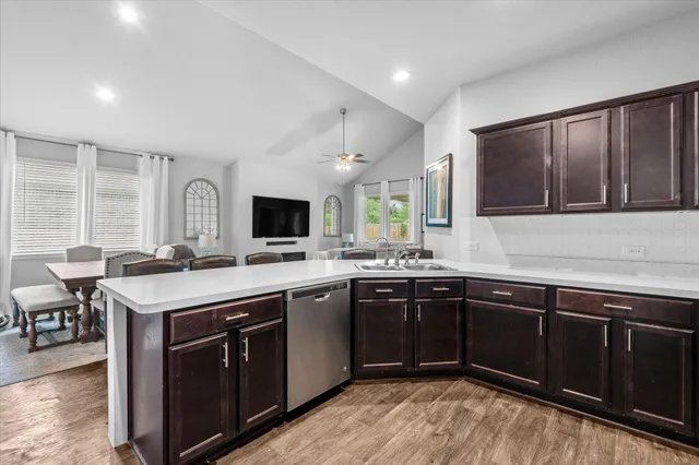 a kitchen with a sink and cabinets