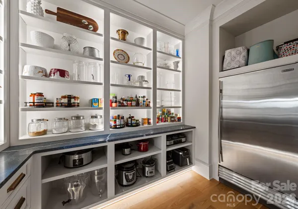 a kitchen with stainless steel appliances and cabinets