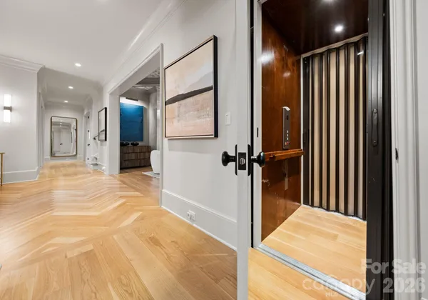 a view of a hallway with a bathroom