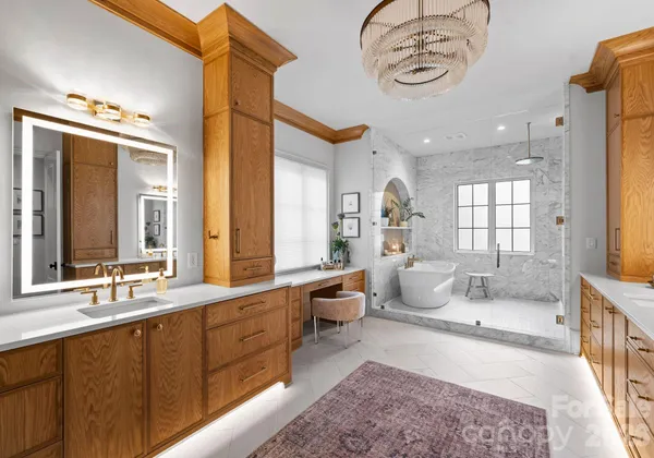 a large spacious bathroom with a large mirror and a bathtub