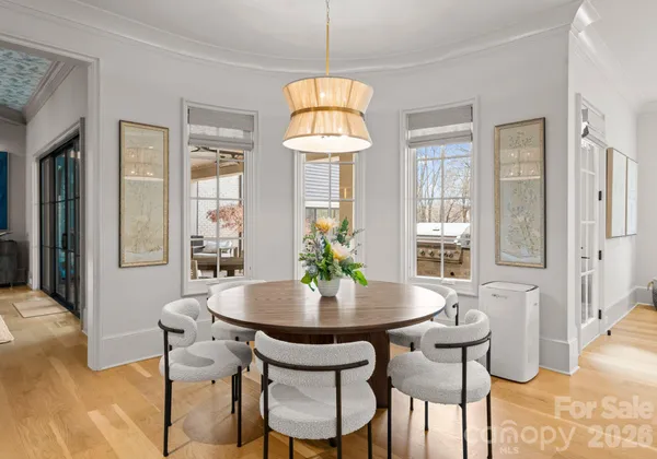 a view of a dining room with furniture and window
