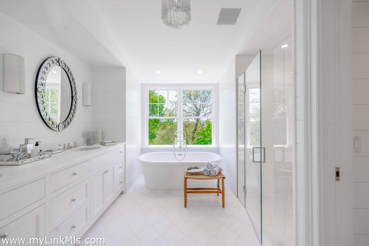 256 Polpis Road Nantucket, MA 02554 - Photo 21 of 30 a bathroom with a two sinks a toilet and a large mirror