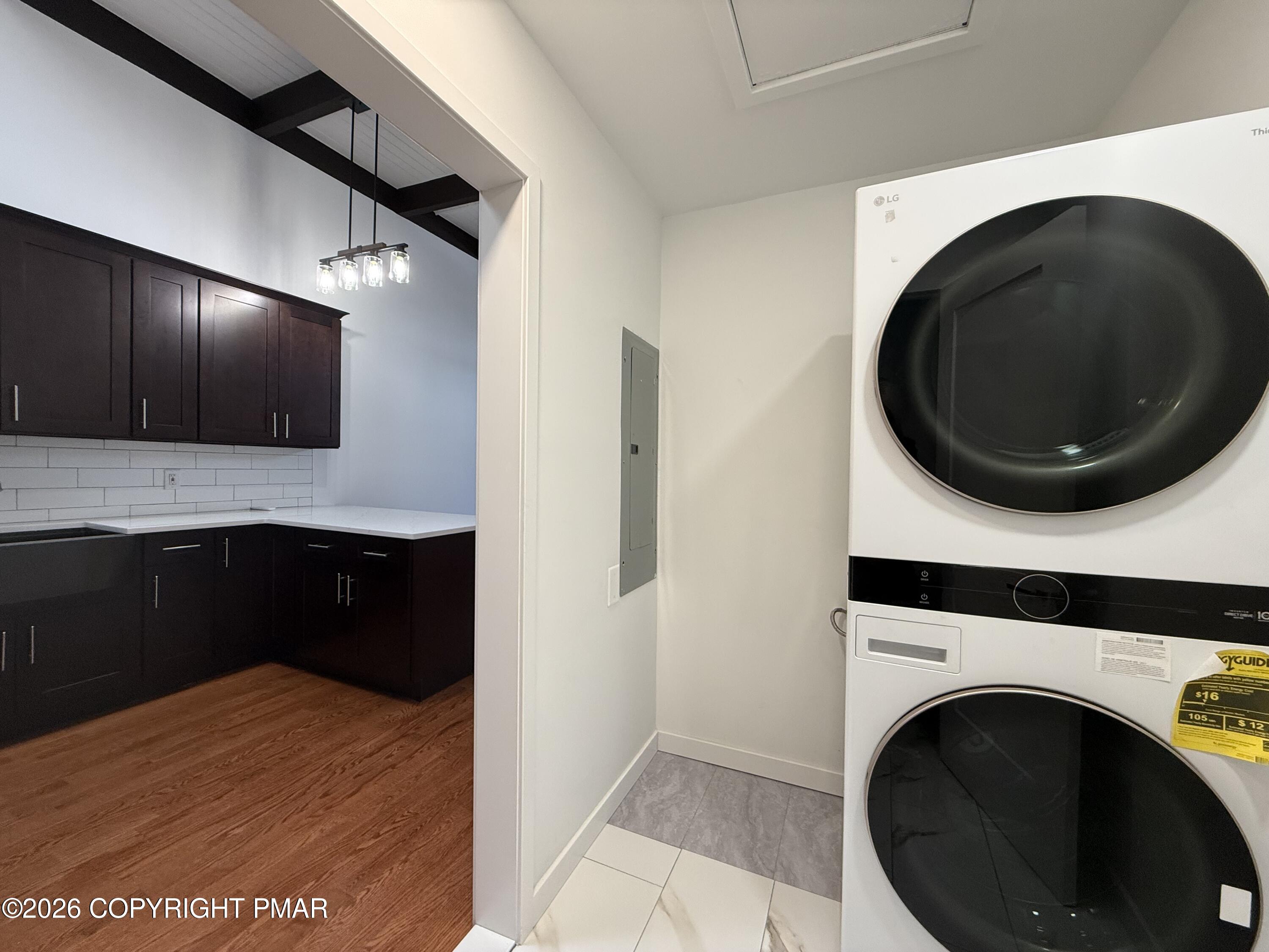 104 Condor Drive, Unit 1 Tamiment, PA 18371 - Photo 12 of 23 a view of a kitchen with a washer and dryer