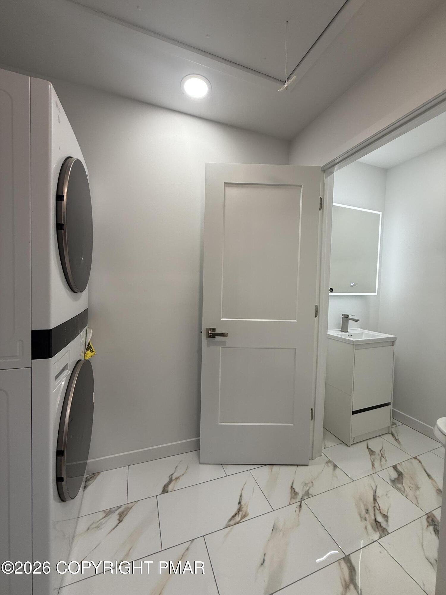 104 Condor Drive, Unit 1 Tamiment, PA 18371 - Photo 13 of 23 a bathroom with a sink toilet and shower