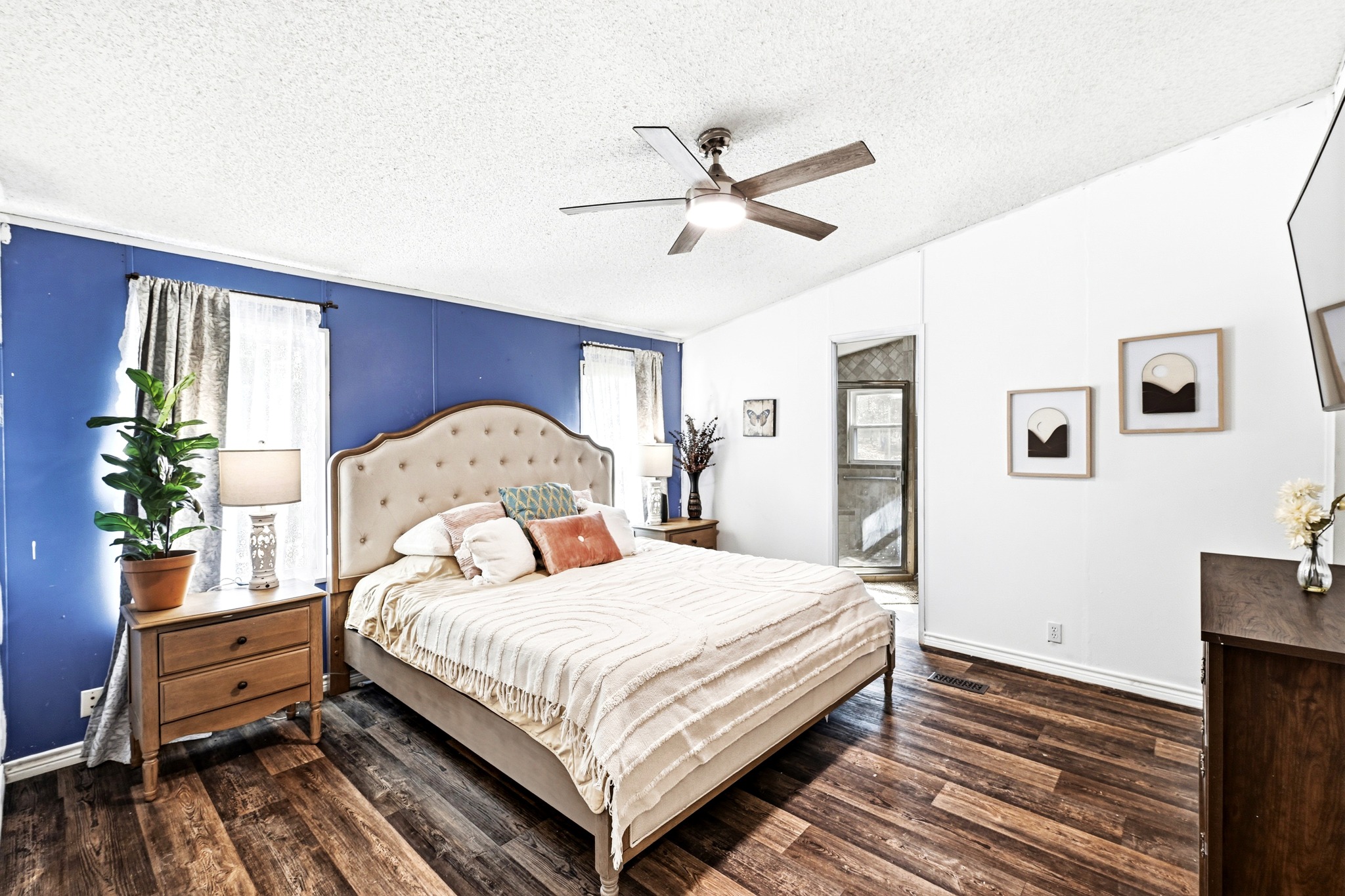 124 Coyote Lane Elgin, TX 78621 - Photo 17 of 40 a bedroom with a bed table and a window