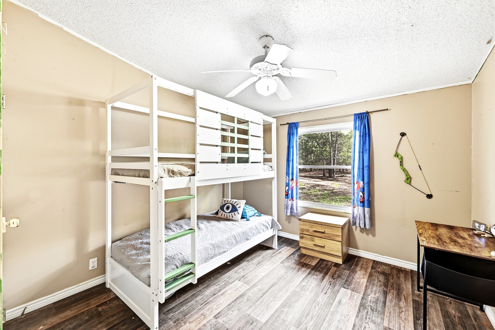 124 Coyote Lane Elgin, TX 78621 - Photo 21 of 40 a bedroom with a bed and a window