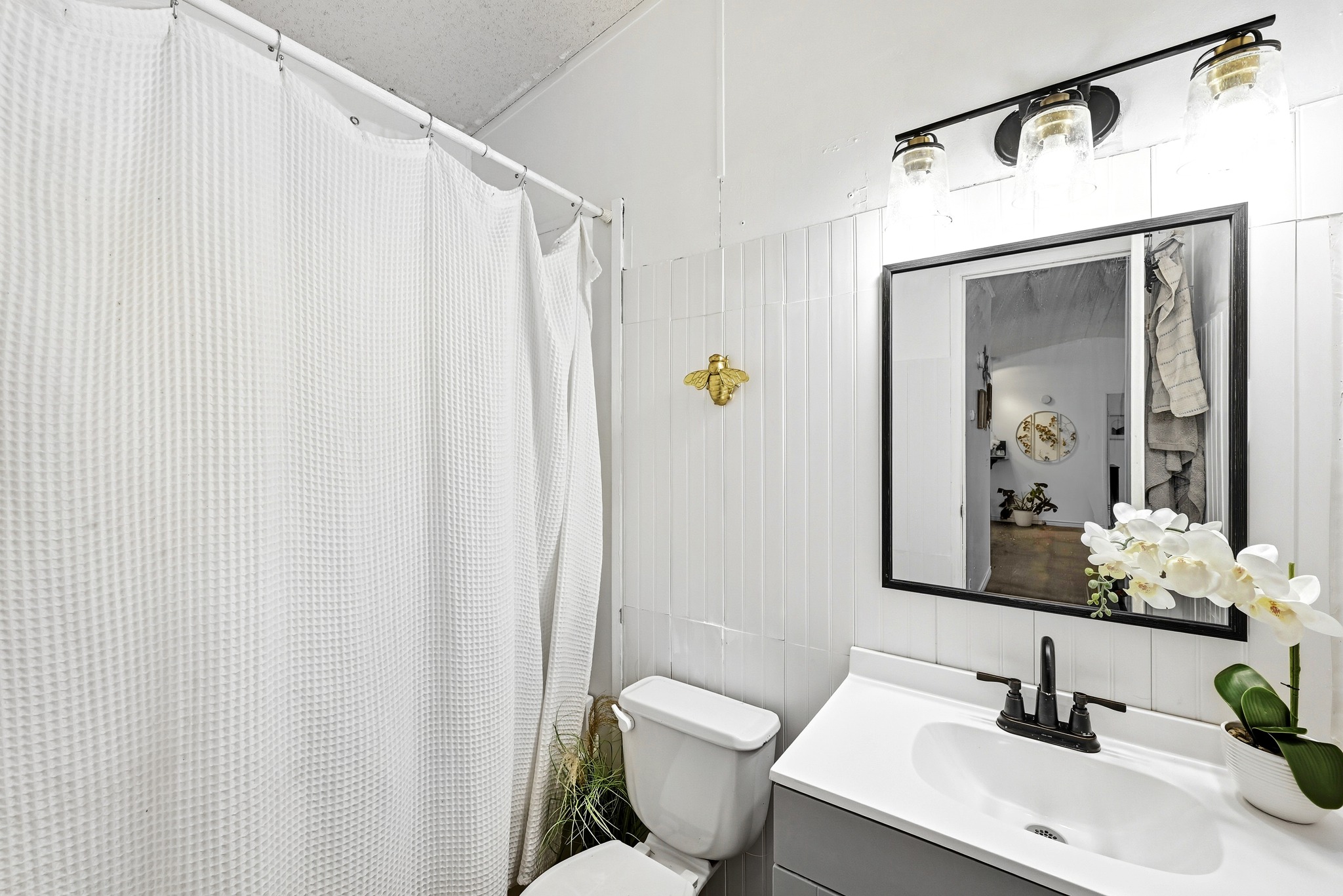 124 Coyote Lane Elgin, TX 78621 - Photo 22 of 40 a bathroom with a sink mirror vanity and toilet