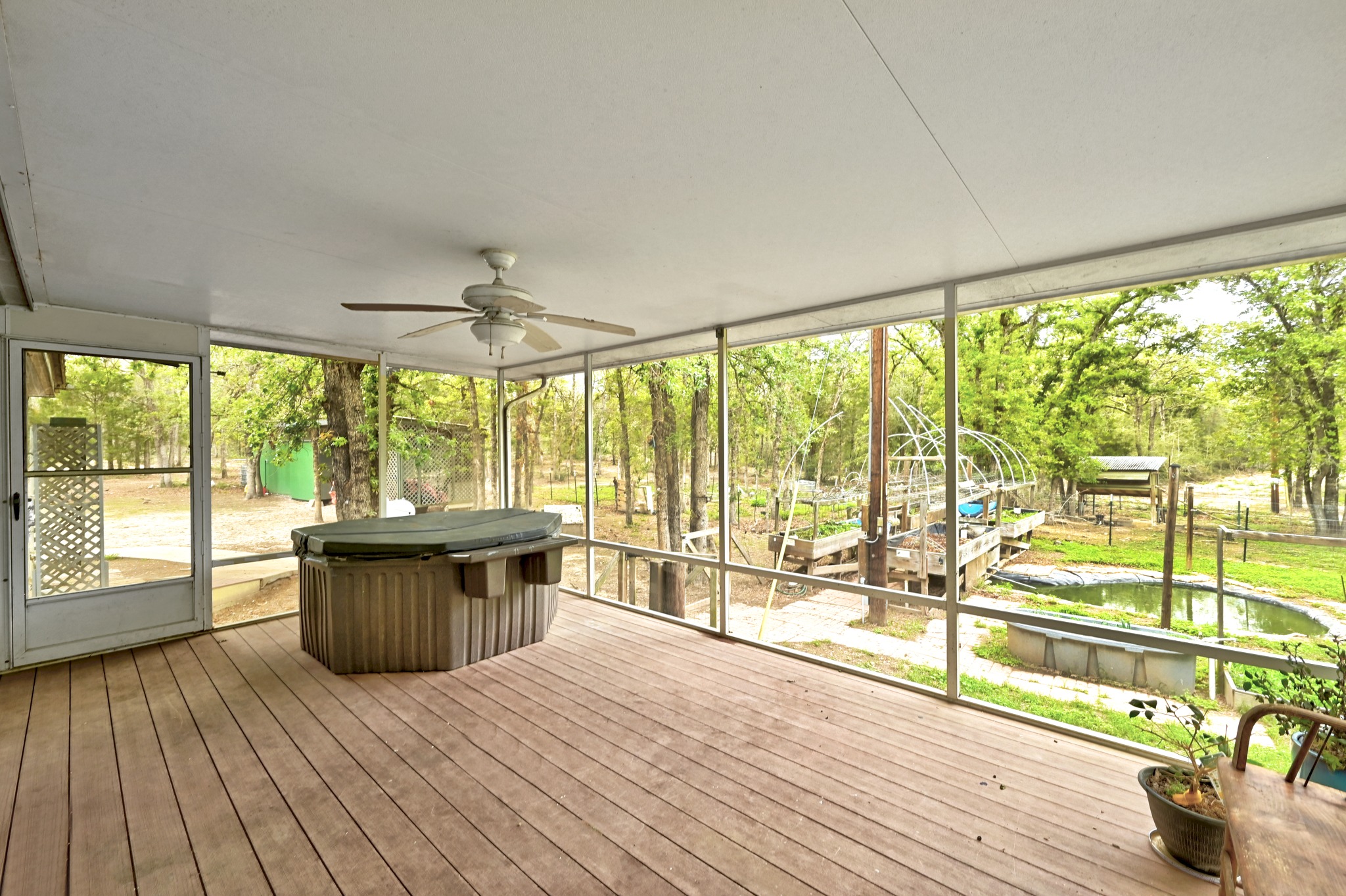 124 Coyote Lane Elgin, TX 78621 - Photo 24 of 40 a living room with wooden floor and large windows
