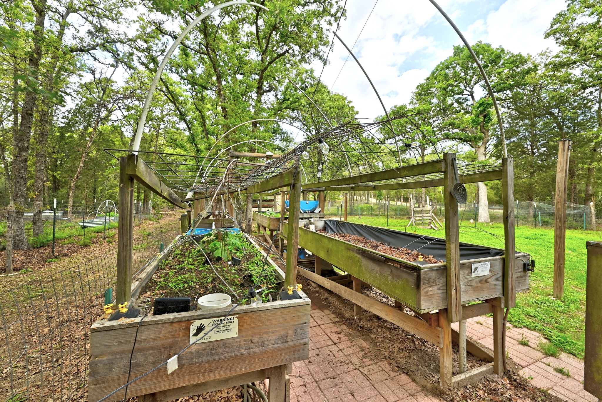 124 Coyote Lane Elgin, TX 78621 - Photo 26 of 40 a view of a bench in a backyard