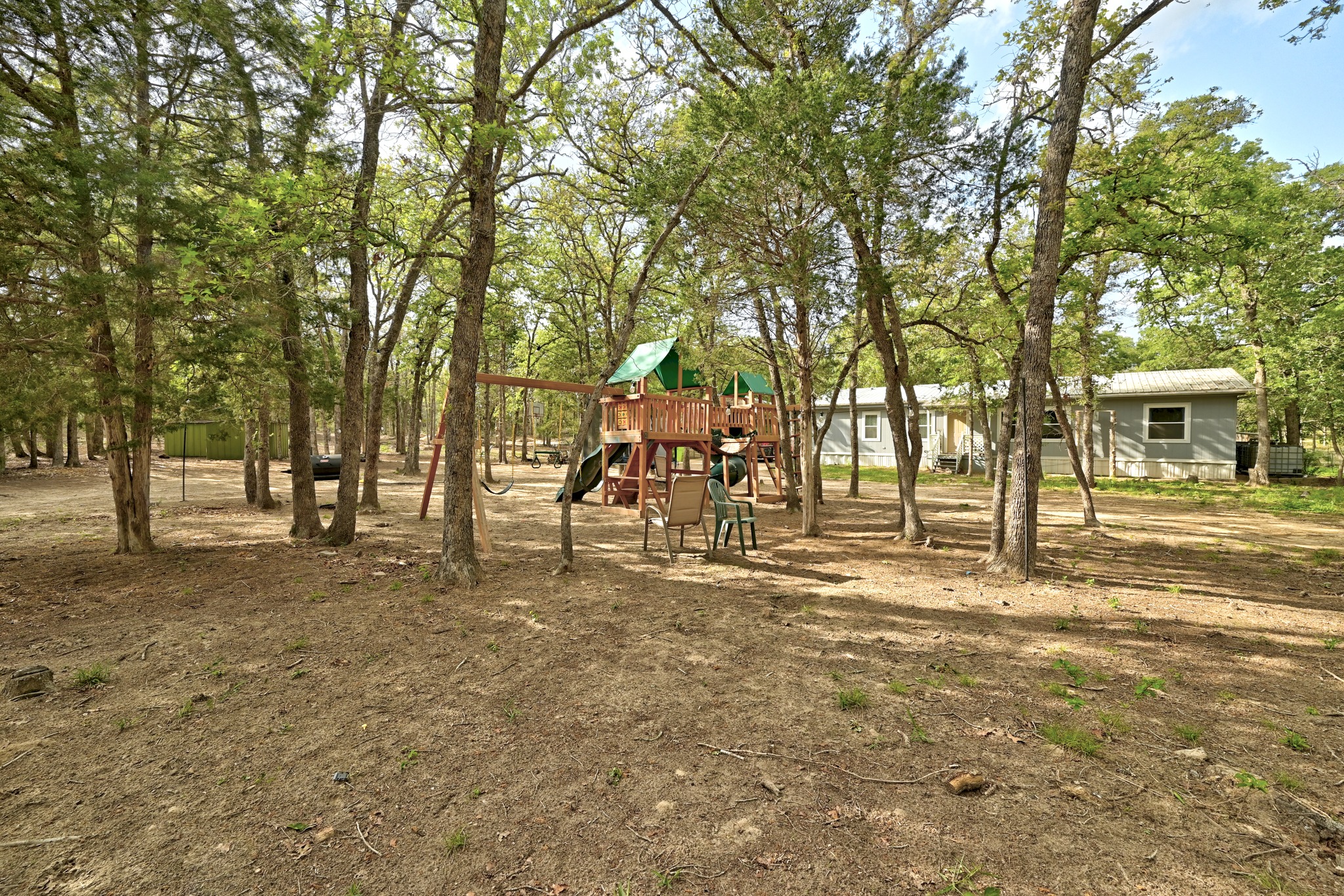 124 Coyote Lane Elgin, TX 78621 - Photo 36 of 40 a view of a yard with large trees