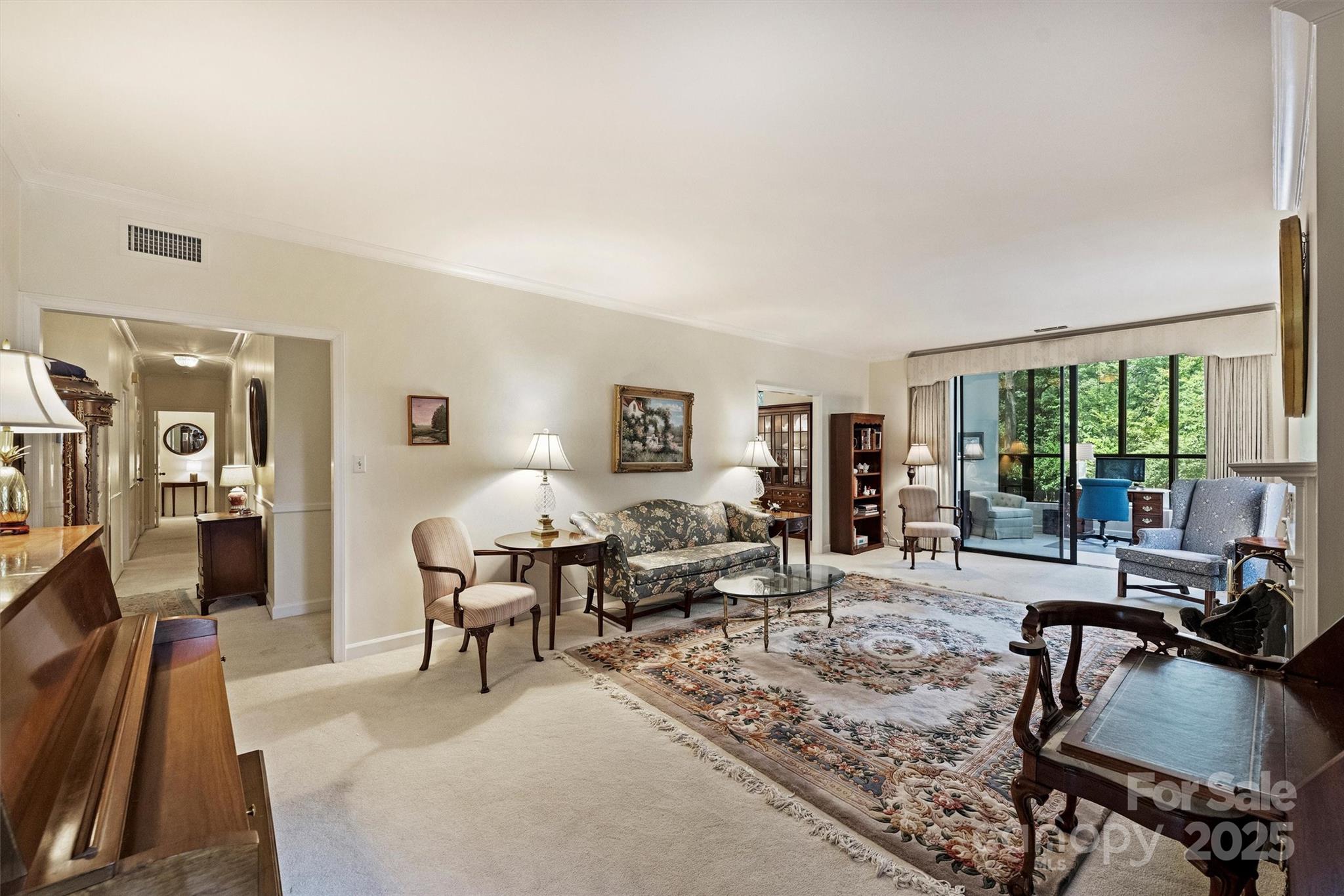 904 Cherokee Road Charlotte, NC 28207 - Photo 11 of 36 a living room with furniture large wooden floor and large window