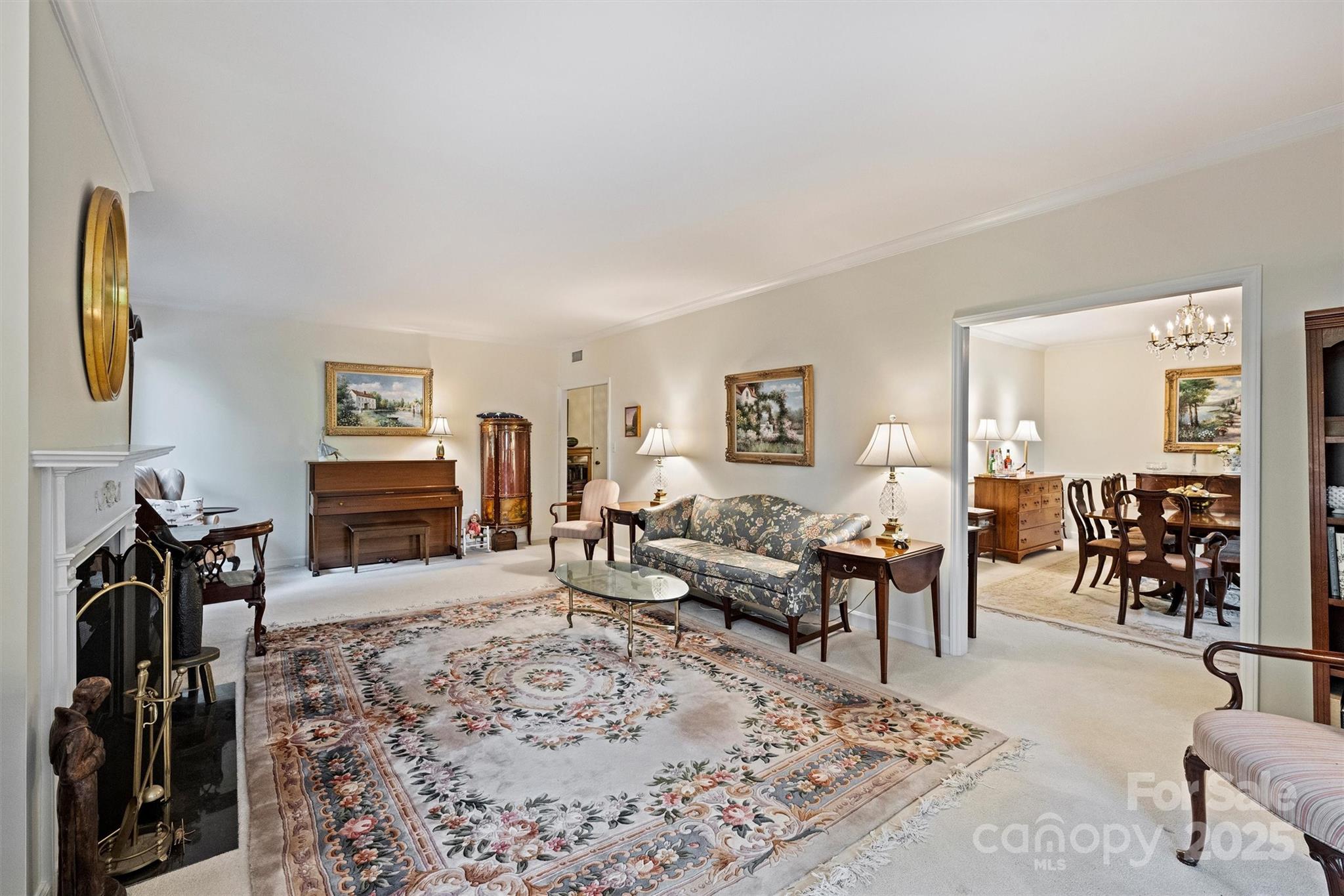 904 Cherokee Road Charlotte, NC 28207 - Photo 12 of 36 a living room with furniture a rug and a flat screen tv