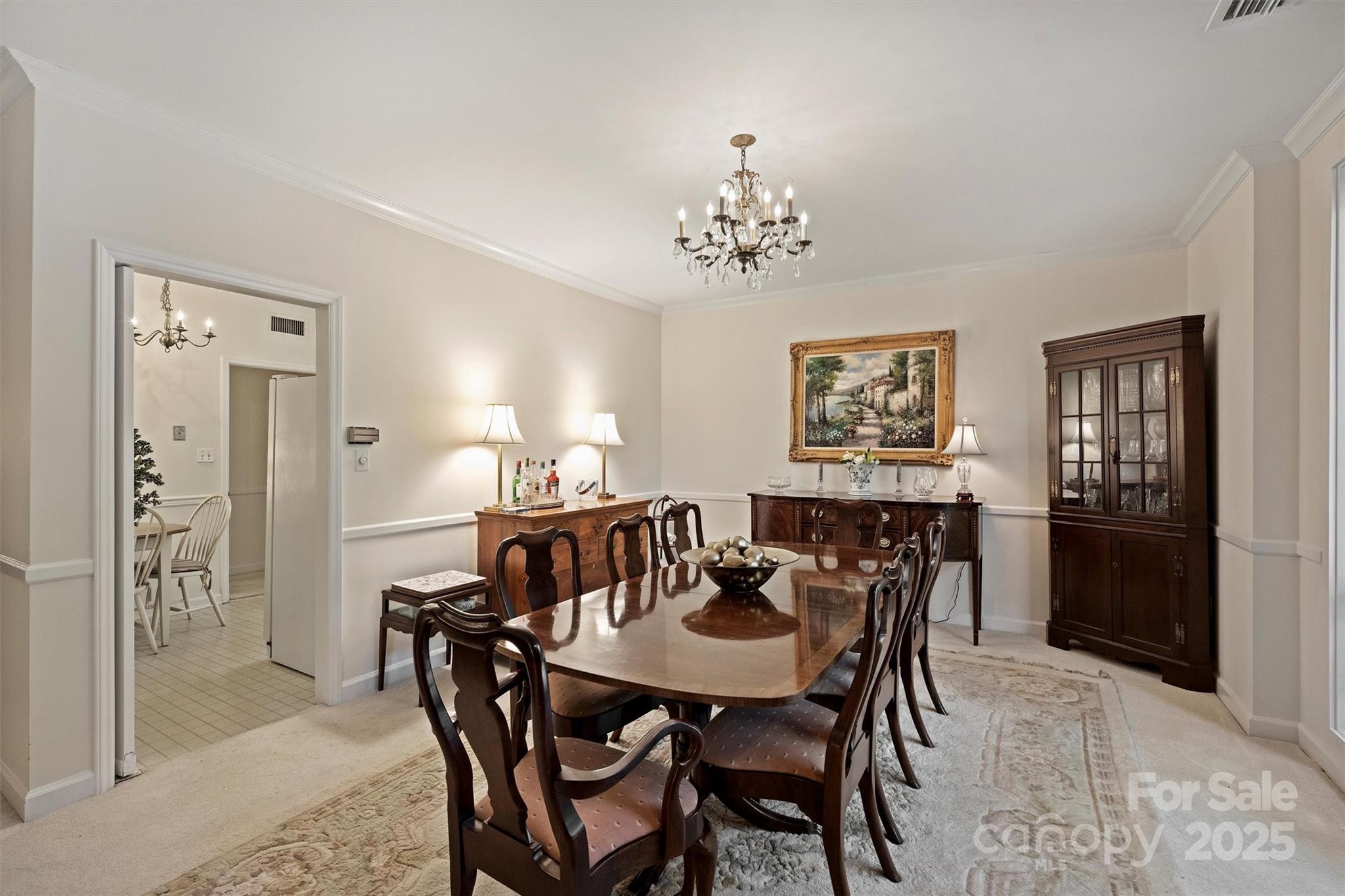 904 Cherokee Road Charlotte, NC 28207 - Photo 16 of 36 a view of a dining room with furniture and wooden floor